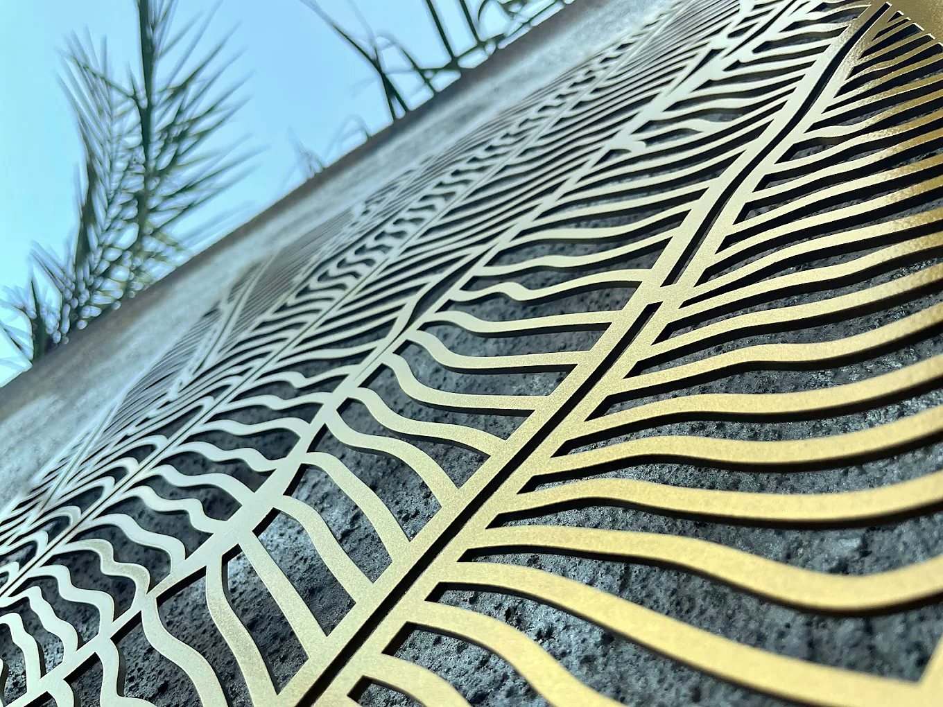 Laser-cut MS boundary panel with feather pattern in gold powder coat